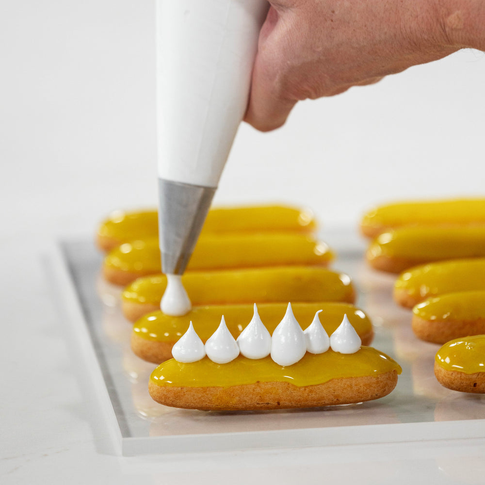 Piping Meringue Over Yellow Lemon Eclairs on PastryClass. Best Haute Food Colors by Ksenia Penkina, Natural Colouring, Water Soluble, Oil Soluble, Fat Soluble Powder, Professional, Chefrubber, Colourmill, Chefmaster, Silikomart, Pavoni, Decorelief, Matfer, PastryClass, Valrhona, Cacao Barry, For Macarons, For Cakes